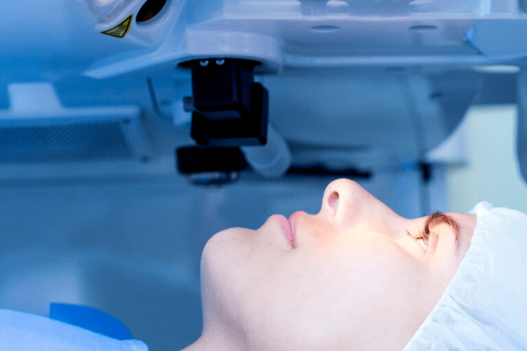 Close-up of a patient undergoing laser eye surgery, representing common vision correction procedures like LASIK and cataract removal